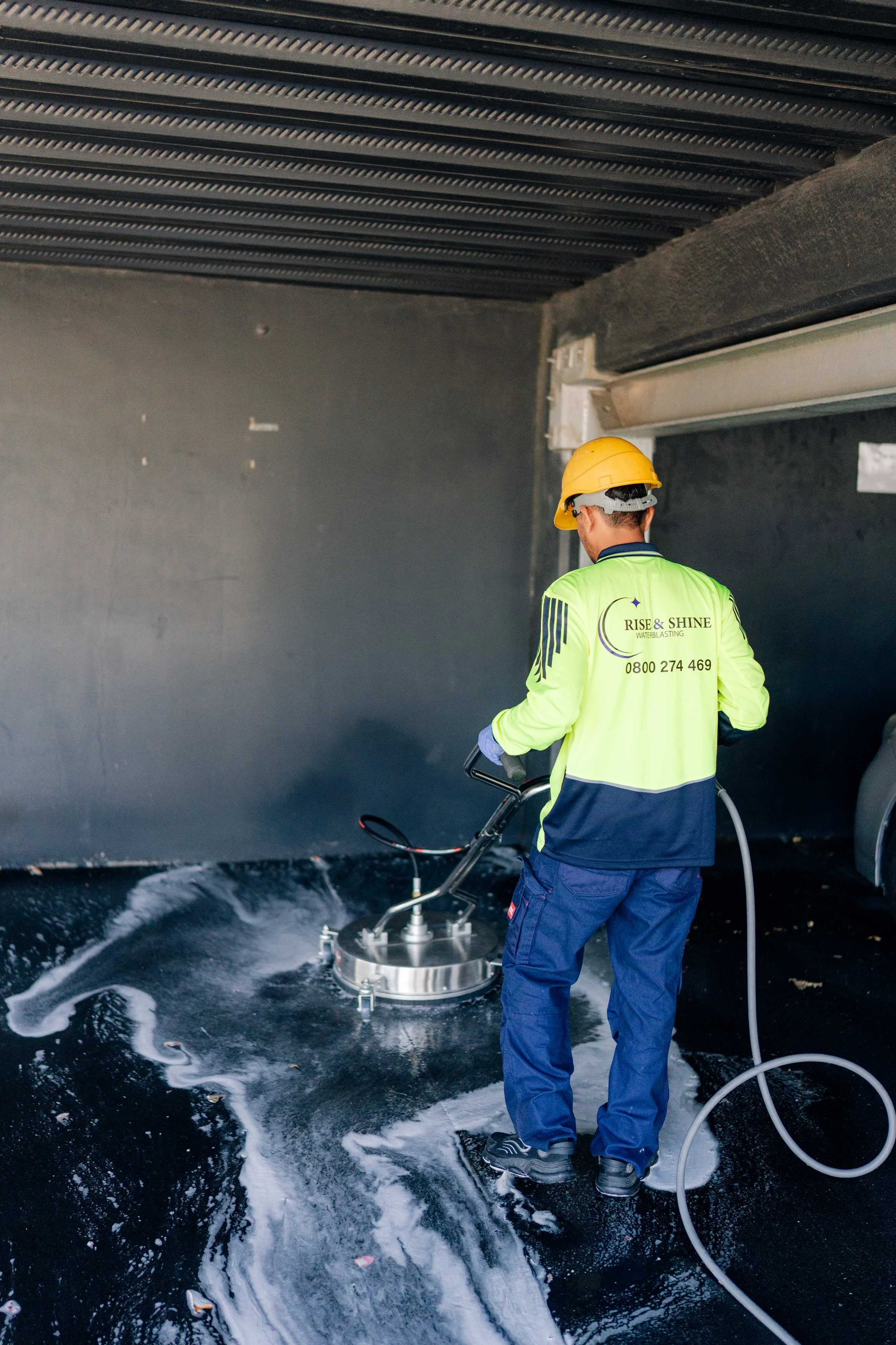 Professional Exterior Water Blasting Services Professional water blasting technician cleaning a residential exterior in Christchurch